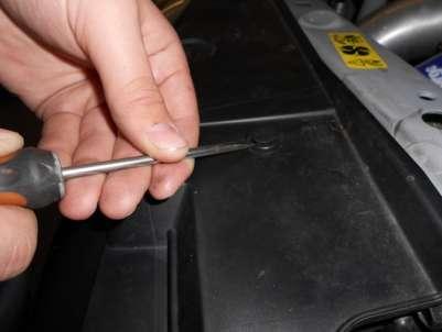 Using a small flat blade screwdriver or similar tool remove the 4
