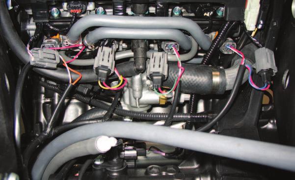 The pair of PCV injector leads with BLUE colored wires will go in-line with the #4 (right most) fuel injector. FIG.