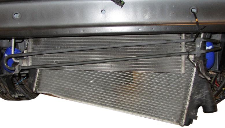 Remove the 2pcs Torx T25 screws that attaches intercooler to radiator (one on each side of