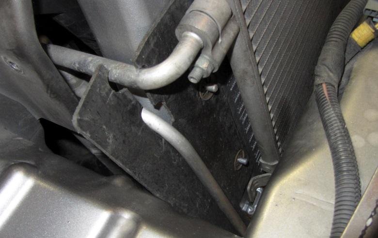 Install the OEM air guides on each side of the intercooler using the tab