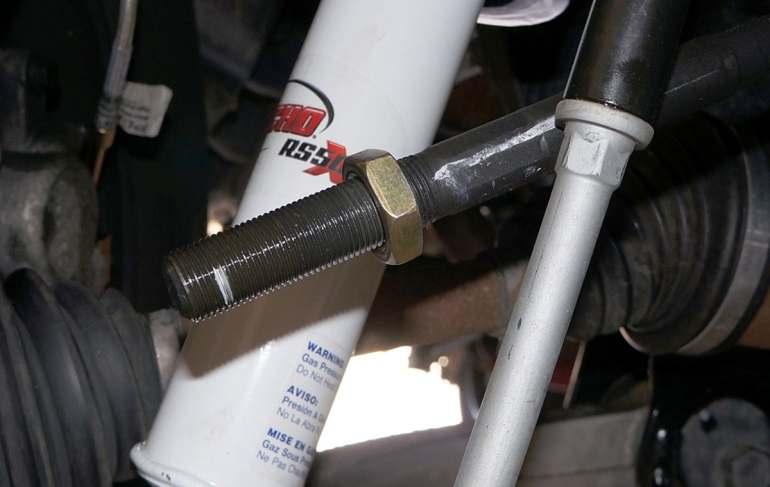 Keep lock nut on inner tie rod and cut 1/4 3/8 off of end of inner tie rod using a cutoff wheel. De-burr after cutting.