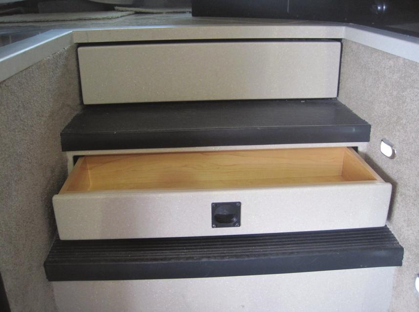 ! Incorporated wood drawer in step well for convenient storage (Figure 2-4)