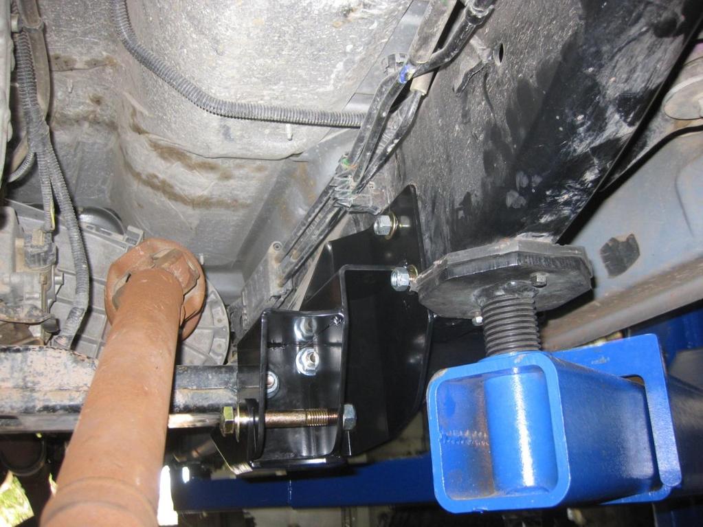 Once through, install the 9/16-12 Flange nuts provided, but do not tighten. DO NOT use a washer under the flange nut.