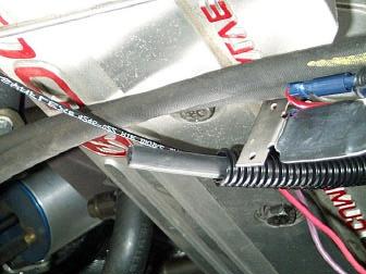 If no other spool valve is present, mount the valve on intake plenum by removing one of the rear bolts and