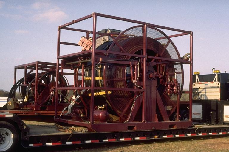 The service reel, left photo, has a hydraulic swivel on front side;