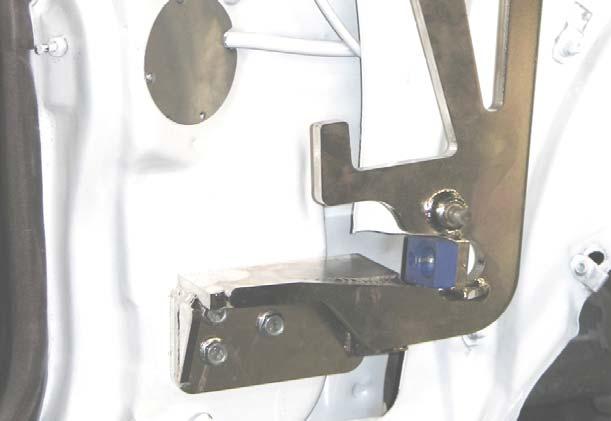 Locate the mounting bolts at the center of their respective slotted mount holes. 6b.
