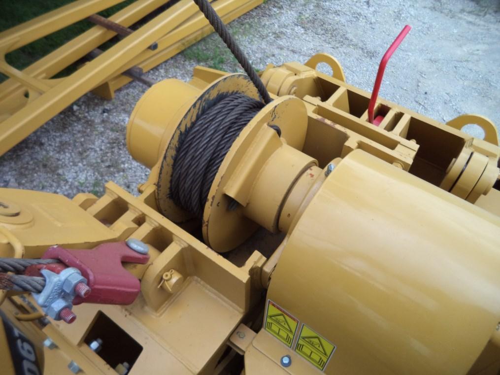 Centralized hydraulic test ports assist with troubleshooting. Infinitely variable speed controls for boom and hook allow for precise operator control.