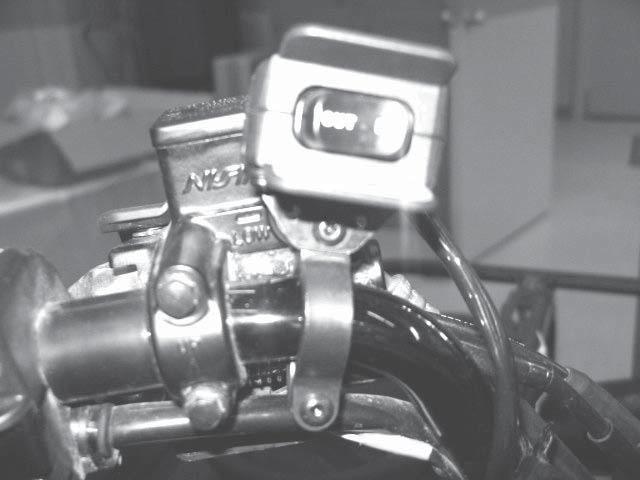 Install the winch rocker switch to the handlebar using the hardware and bracket supplied with the
