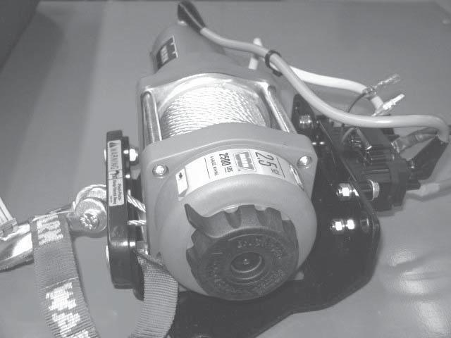 (figure 8) Install the hook using the pin and cotter pin supplied with the winch. 9. Locate the front mounting locations on the front frame tubes of the Grizzly. (figure 9) 10.