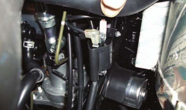 FIG.K 14 Locate the ignition coil on the right side of the quad, forward of the engine; and