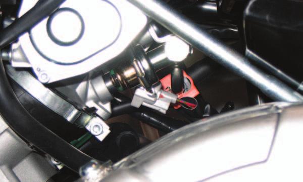 8 Attach the MicroTuner wiring harness to the injector and the stock wiring harness as shown in