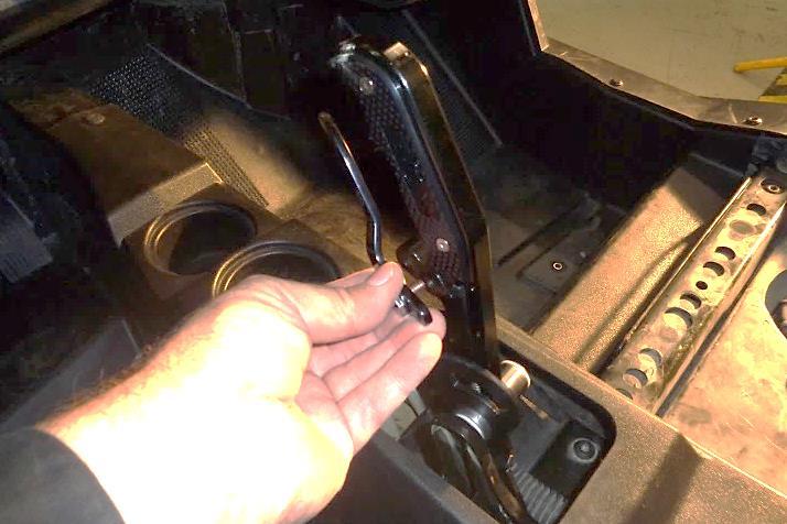 Note that the opening in the top of the shifter boot (6) should be