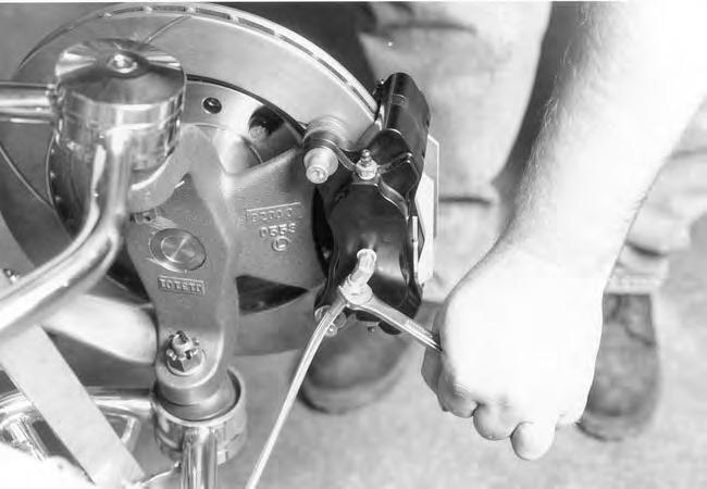 You can now final tighten the brake line at the caliper adapter. Repeat this procedure for the passenger side brake line assembly.