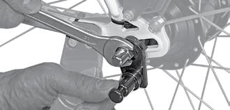 the owner s manual of the bicycle. Be sure to hold the axle hitch in place while tightening the nut. 5.