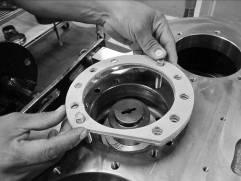 Place the bearing cup into its bore. Install the rear cap with the original shim pack. See Figure 74.