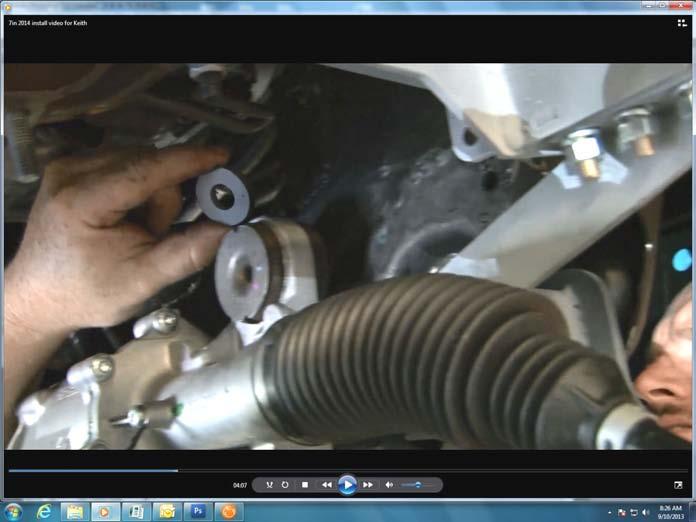 Slide steering extension onto rack and pinion steering stud as you are installing it. See Photo 31.