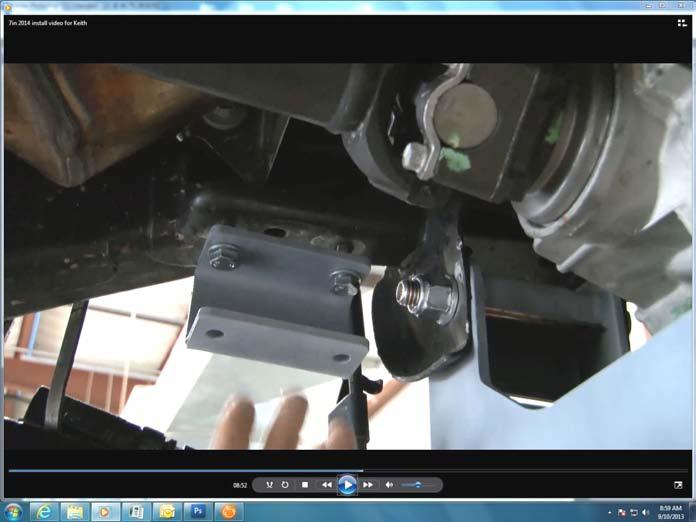 Install upper and lower control arms using stock bolts. See Photo 39.