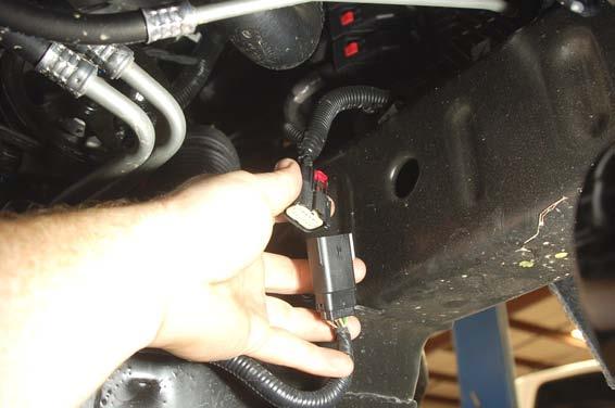 Remove the 6 bolts holding the factory skid plate using a 15mm socket.