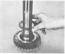 Clean threads of drive gear and nut and apply grade AVV Loctite (See Illustration #59). 6.