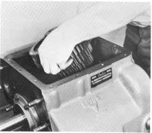 REASSEMBLY 2. Install the short key in countershaft, tapered end against roll pin. 3. Install the long key in keyway in countershaft (See Illustration #67). 4.