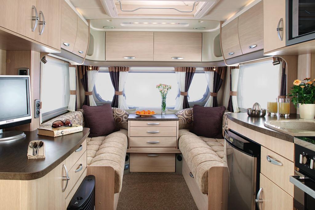 Inside the distinctive light Oregon pine furniture and new fabrics give a fresh feel to the newly designed space, where the contour of the front panel allows for maximum headroom and roof-locker