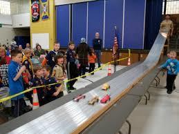 The Pinewood Derby allows boys to build small wooden cars (from a