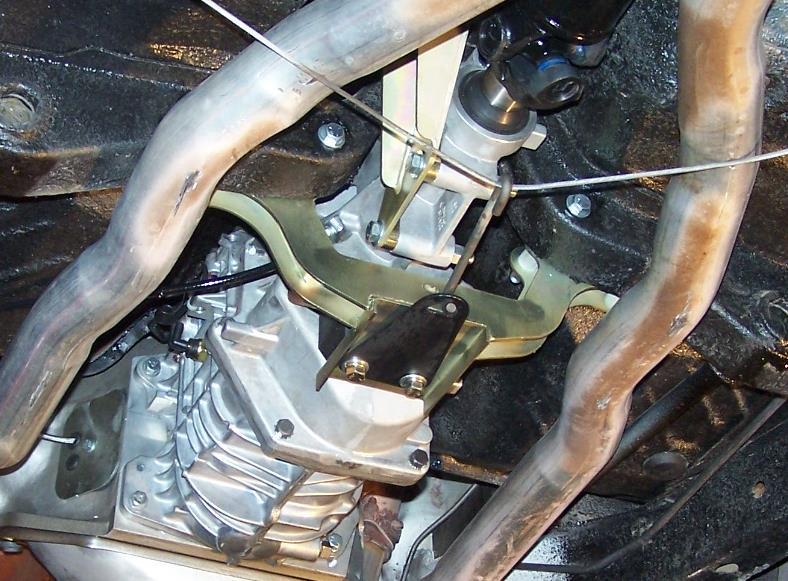 20. Tighten exhaust. 21. Reinstall shift tower that was removed earlier. 22. Bolt on shifter handle with 3/8 x1 bolts and washers provided (HWA-PACK L). Use medium strength threadlock compound.