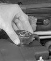 You can remove the coolant surge tank pressure cap when the cooling system, including the