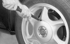 Removing the Wheel Cover The tools you ll be using include the jack (A) and the wheel wrench (B).