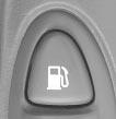 To open the fuel door, press the button located on the driver s door trim near the trunk release button. Pull the tab toward you to release the fuel door.