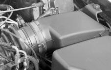 Engine Air Cleaner/Filter To check or replace the engine air cleaner/filter, do the following: 1. Unscrew the two wing screws on the outboard side of the housing cover. 2. Remove the cover. 3.