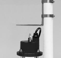 Cut a piece of 1½ rigid PVC pipe long enough to reach from the elbow of the backup pump to one (1) foot above the floor.