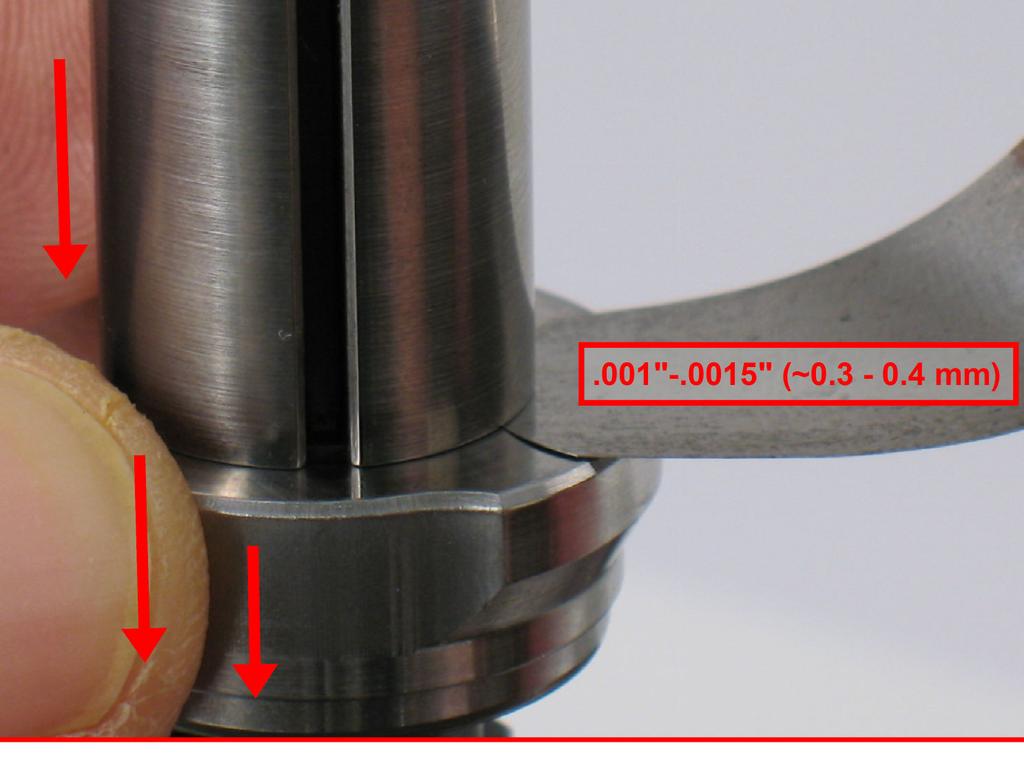 of the rotor. Push down on the bearing plate to take movement out of the bearing.