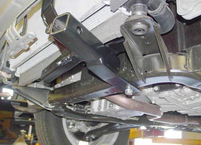 Bolt the driver and passenger side main receiver braces together using the two ¼" x 1¼" x 4½" backing plates and the four 3/8" x 2¾"