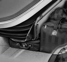 VARIABLE CONVERTIBLE TOP STORAGE COMPARTMENT FLOOR Purpose of the System: The trunk of the E46 convertible offers a new feature called the Variable Convertible Top Storage Compartment