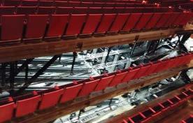 entire seating area of an auditorium within an hour by lifting and rotating (inverting) one full row of seats at a time.