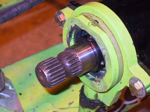 Remove any tape from the splined shaft, and any booklets from the driveline. Install the shaft spacer (A101-157) onto the splined shaft tight against the steady bearing collar.