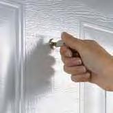 An inconspicuous round cylinder (cannot be integrated in the home locking system) releases your garage door and you