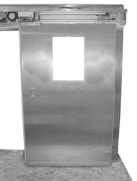 ADJUSTMENTS DOOR PANEL NOTE: The trolleys are shipped with the anti-skip/ counter roller nut tight. (See Figure 7.) This prevents the door from sliding back and forth during transport.