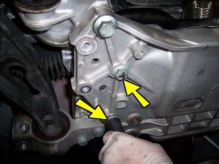 Loosen and remove the bolt that attaches the mount to the engine.
