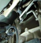The upper bolt can be accessed through the shifter hole in the floor board if needed. (Fig13A & 13B) 12.