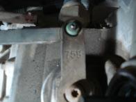Using a 10 mm socket, remove the four bolts securing the shifter pivot assembly.