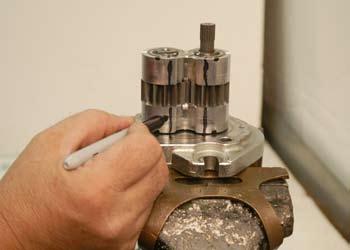Mark the front bushing assembly down the side with two parallel lines (Fig.