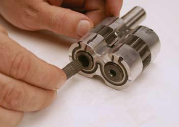 11. Repeat the above 2 steps for the second bushing, gear seal and back-up ring. 14. Install the second bushing onto the 2 gears (Fig. 0490). 12.