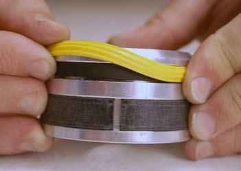 Install the piston seal into the narrowest groove of the piston on