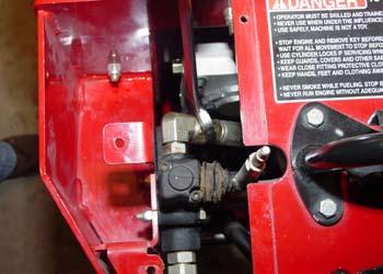 5. Connect the hydraulic pressure hose to the rear fitting on the auxiliary valve and tighten using