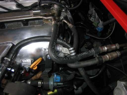 Install the ew Intake Manifold: Secondary Throttle Cable Mount Throttle Cable Mount Carbon Canister Solenoid Bracket 8) Put the new intake manifold gasket into place and start to slide the manifold