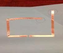 Leaving a small (1mm) gap, place another piece of copper tape following the long edge of the paper for 2