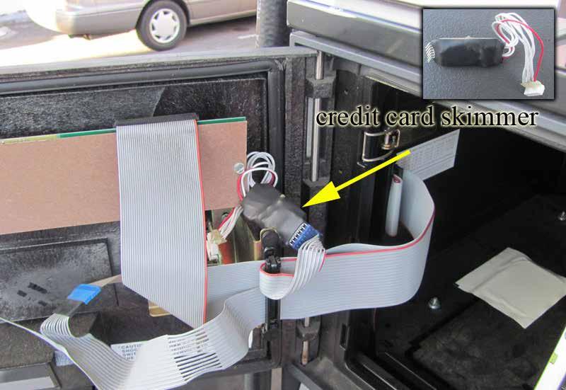 An example of a skimming device installed directly behind the card reader and