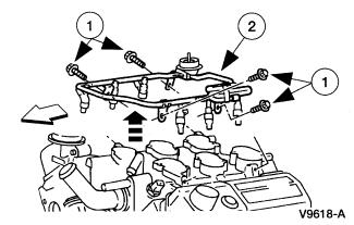 Remove the fuel injection supply manifold and fuel injectors (9F593). 1. Remove the four bolts. 2. Remove the fuel injection supply manifold and the fuel injectors. 31. Raise and support the vehicle.